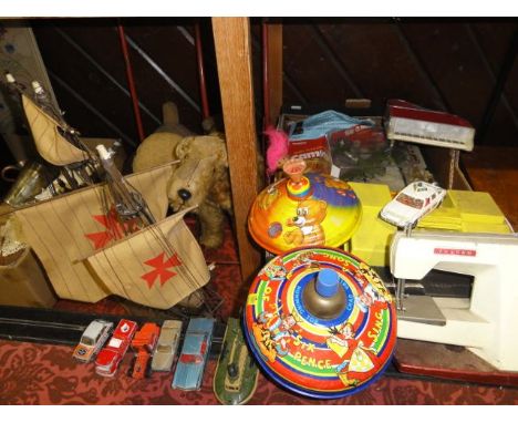 A quantity of vintage toys and effects to include a selection of Corgi and other model vehicles, a Chad Valley spinning top a