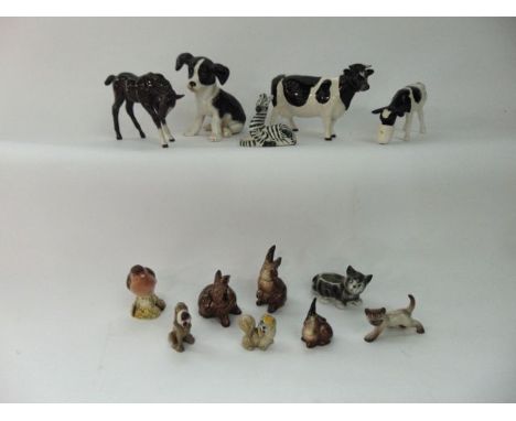 A Beswick model of a Friesian cow, a Beswick style model of a calf drinking from a pail, with painted mark to base S Kelly an