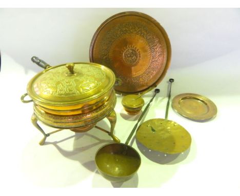 An unusual eastern copper two sectional saucepan, the lid with incised detail of dancing figures supported upon a tripod stan