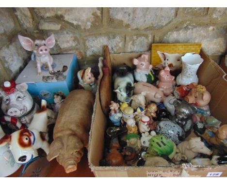 A quantity of ceramic and other models of pigs including Wade NatWest pig money banks, etc