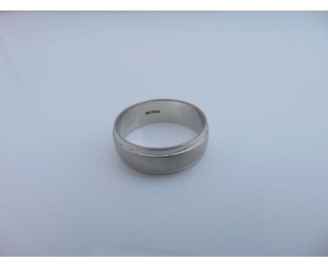 A gentleman's platinum ring, stamped 950, the plain polished shank applied with a central brushed band, 4.9g, size U