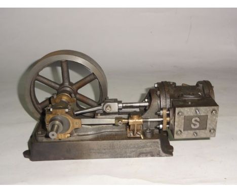 A vintage custom made stationary engine by Stuart Turner Limited, Engineers, Henley-on-Thames comprising a single wheel and p