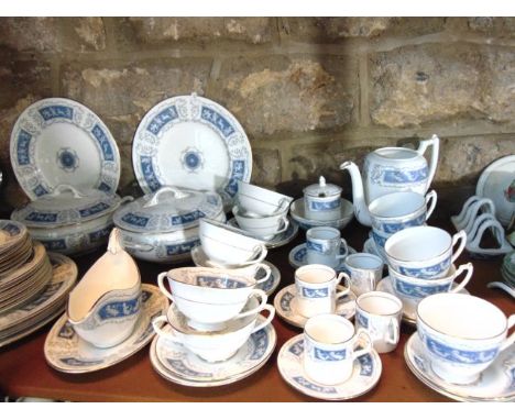 An extensive collection of Coalport Revelry pattern dinner, tea and coffee wares including a pair of circular covered tureens