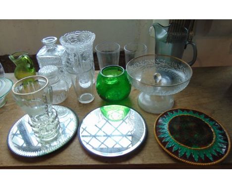 A selection of glassware to include a drinking vessel with heavy cut ringed detail and foot with etched detail of a courtyard