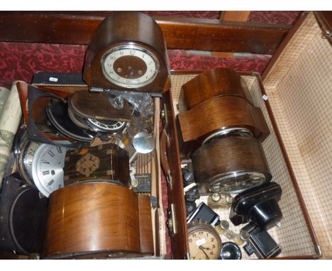 Five 20th century timber cased mantle clocks (some incomplete) together with a quantity of clock faces, doors, springs and ot