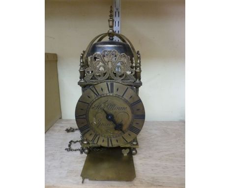 An old English style lantern clock of usual design striking on a single bell, the dial engraved Thomas Moore, Ipswich