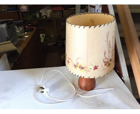 A small wooden G Plan style table lamp.