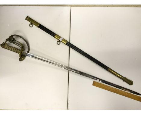 A Wilkinson Sword and scabbard 805 mm. The scabbard and blade are not bent out of shape the blade measures 805 mm the scabbar