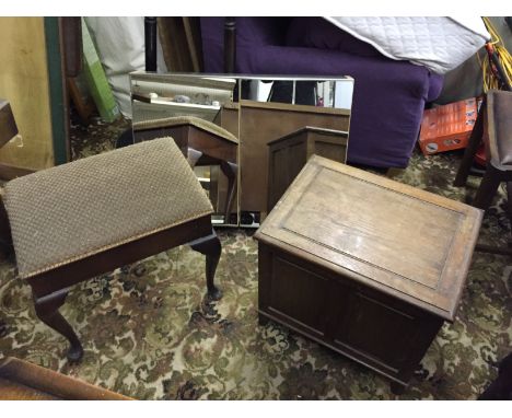 A piano stool with storage and a commode.