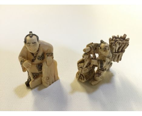 A small ivory carving of a woodsman with an axe 50 mm and another carving of a man carrying a wood bundle with a child in a b