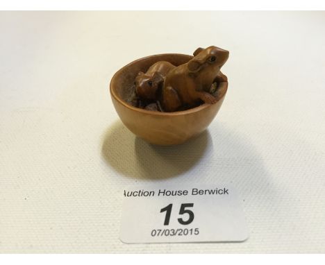 A wood netsuke of two mice in a bowl, signed. 45 mm