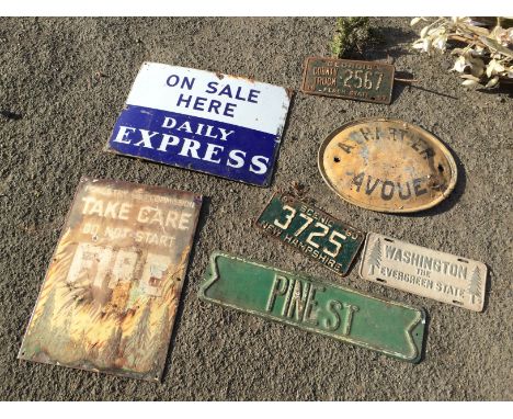 A selection of metal number plates and enamel signs, including a Daily express newspaper sign a Forestry commission fire sign