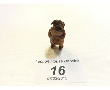A carved wood netsuke of a pig 85 mm.