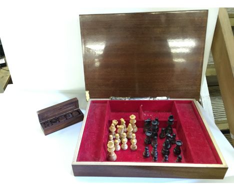 A boxed chess set and a set of die.