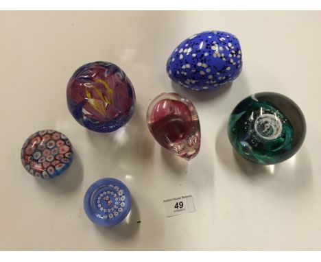 Six paperweights four Scottish Borders Art Glass one Caithness and one other.