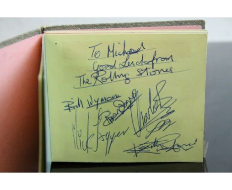 Music Autographs - Autograph book containing The Rolling Stones to one page featuring Brian Jones, Jagger, Richards, Wyman, a