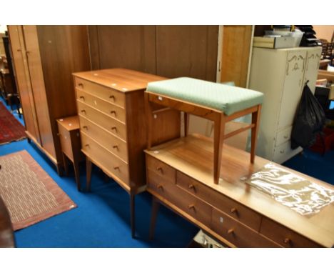 A vintage bedroom suite labelled AC (Alfred Cox) bleached walnut , comprising wardrobe, dressing table , five drawer chest an