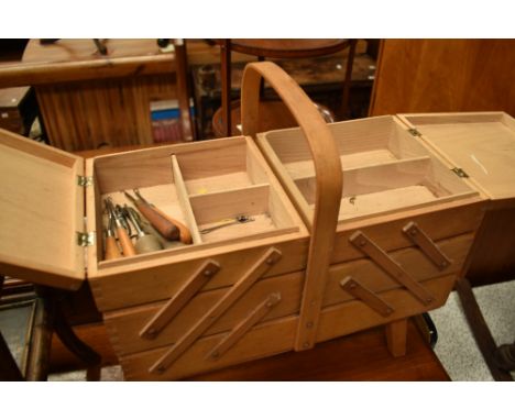 A vintage cantilever sewing box , containing accesories including crochet hooks