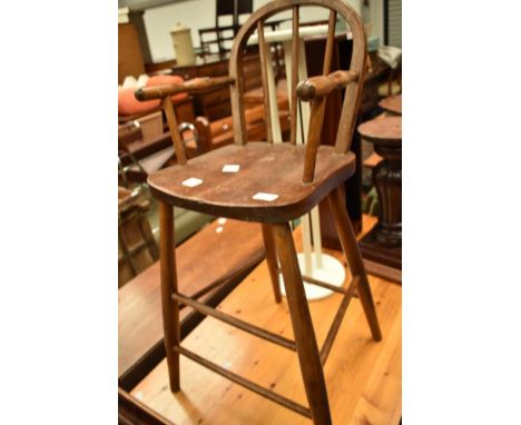 A vintage high chair (decorative only)