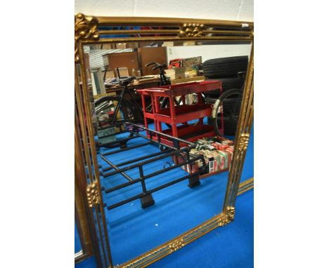 A Deknudt Decora gilt frame wall mirror having mirror facets, portrait or landscape orientation, approx 118 x 89cm