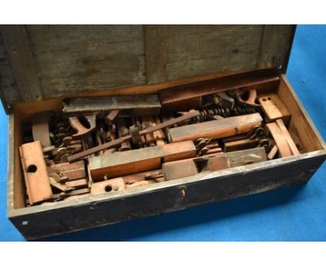A vintage tool chest containing large collection of woodworking planes
