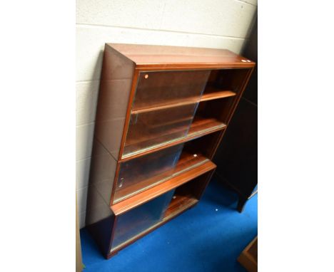A vintage mahogany stacking bookcase, Minty style
