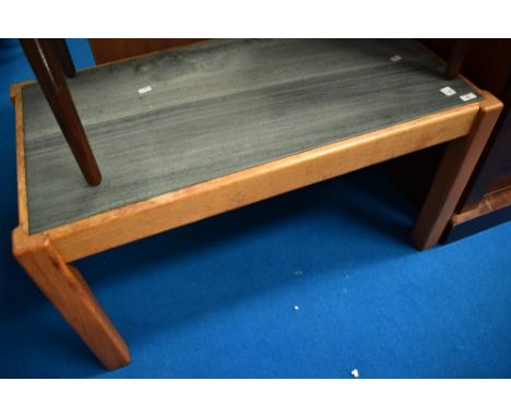 A vintage teak framed coffee table having slate top, approx. 97 x 52cm