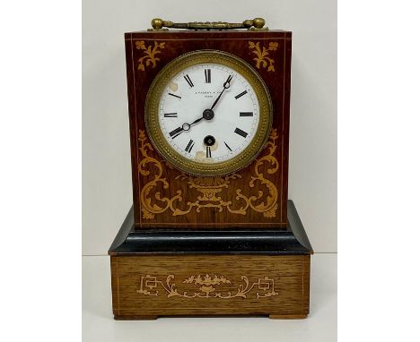 A mantel clock with decorative boxwood foliate inlay to front and sides with bronze gilt carrying handle  made by J. Valery, 