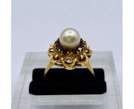 An 18ct gold, pearl and ruby ring (6.8g) Total weight, one missing stone.