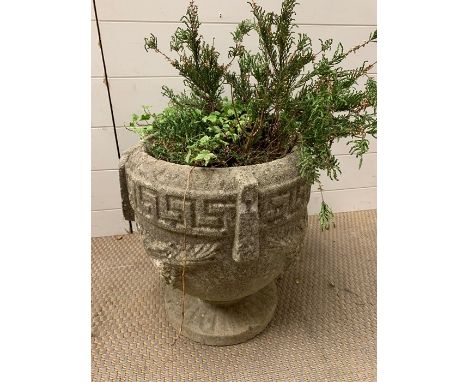 A re-conditioned stone garden planter 