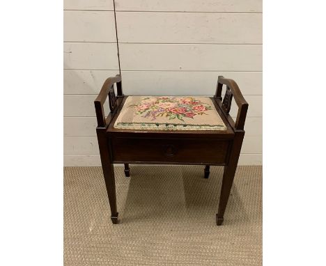 A mahogany piano stool with tapestry seat 