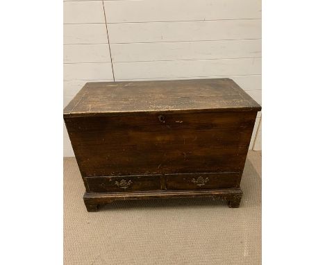 An Antique Scumbled pine trunk with two drawers. (H77cm W104cm D50cm)