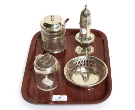 A silver caster, by Viners, Sheffield, 1933; a silver pierced dish, Chester, 1914; a silver and glass preserve jar and spoon,
