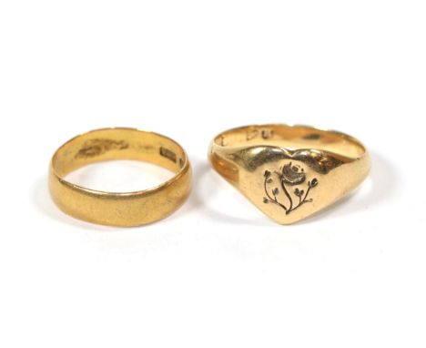 A 22 carat gold band ring, finger size K1/2; and a signet ring, marks rubbed, finger size S1/2 (2).  22 carat gold ring 3.28 