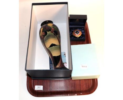 A Moorcroft vase, with box and booklet; a limited edition Halcyon Days enamel box of the Royal Albert bridge 145/150, boxed a