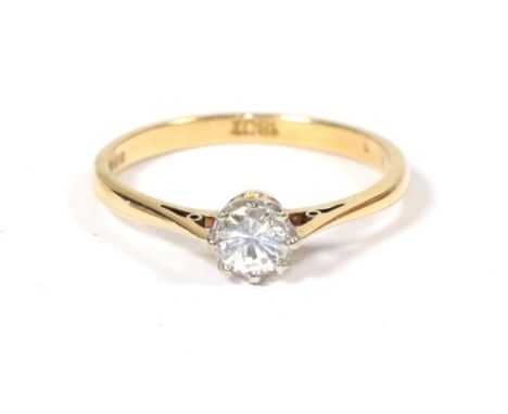 An 18 carat gold solitaire diamond ring, a round brilliant cut diamond in a claw setting, to knife edge shoulders, estimated 