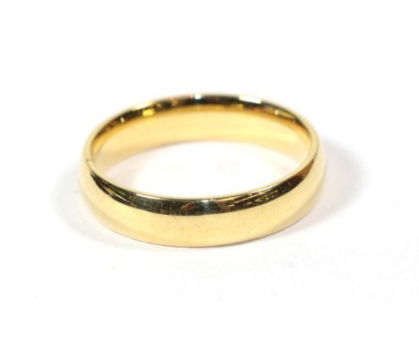 An 18 carat gold band ring, finger size V.  Gross weight 8.24 grams. 