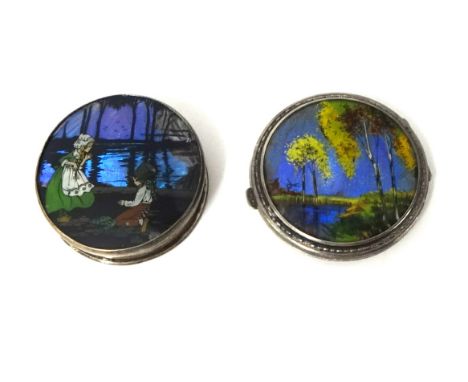 A silver "butterfly wing" circular compact, Birmingham 1928, depicting a woodland scene and a silver "butterfly wing" circula