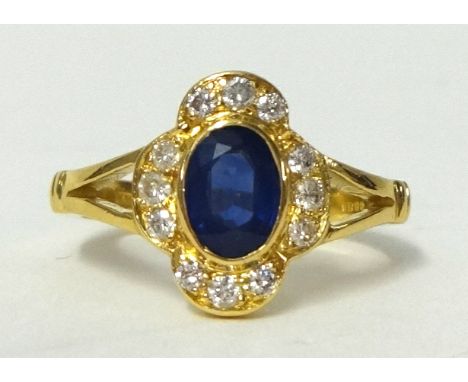 An 18ct gold sapphire and diamond ring, size K