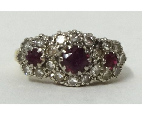 18ct yellow gold ruby and cluster ring, size G1/2.