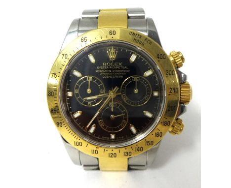 Rolex Daytona. A gold and stainless steel gentlemans Oyster Perpetual Cosmograph Wristwatch, circa 2003, reference 116523, ca