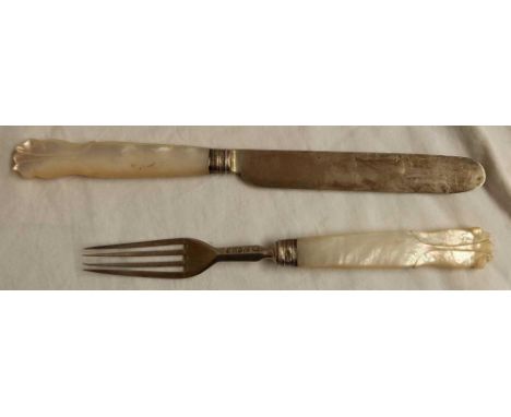 AN EARLY VICTORIAN KNIFE &amp; FORK WITH CARVED M.O.P HANDLE, SHEFFIELD 1874
