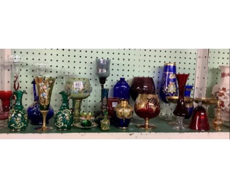 LARGE SHELF OF COLOURED GLASSWARE WITH GOBLETS, VASES, CANDLE HOLDERS ETC