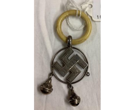 A BABY TEETHING RING, SILVER MOUNTED, THE GOOD LUCK CROSS, B'HAM 19? 