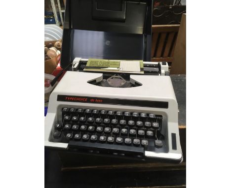 A TYPECHOICE DELUX PORTABLE TYPEWRITER IN CASE
