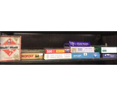 SHELF OF VARIOUS JIGSAW PUZZLES &amp; BOXED MONOPOLY GAME