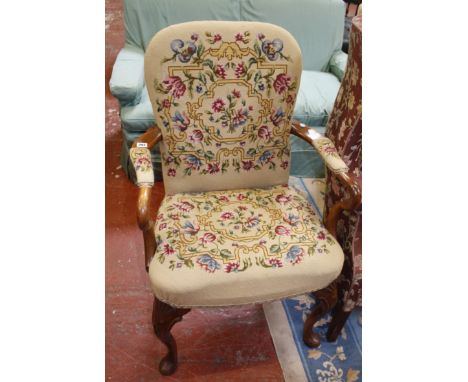 An Edwardian yew wood arm chair with tapestry back, seat and arm pads. Best Bid