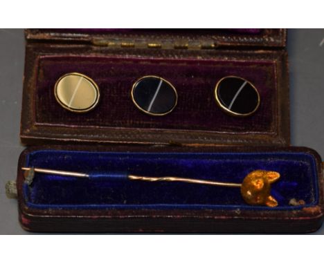 An early 20th century 9ct gold fox's head, stamped, mounted as a stick pin, c.1910; a set of three late Victorian black hards