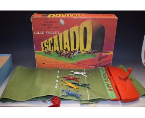 A vintage Chad Valley Escalado horse racing game, with five cast metal horses, boxed