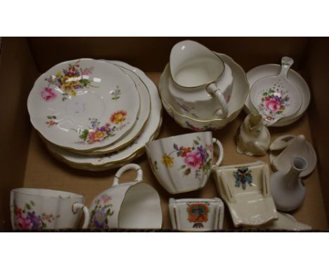 A Royal Crown Derby Posy pattern tea strainer on stand; three tea cups, saucers and tea plates, milk and sugar; crested china